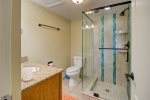 Second bathroom with glass enclosed tile shower